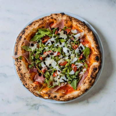 
          Pizza Prosciutto Crudo e rucola